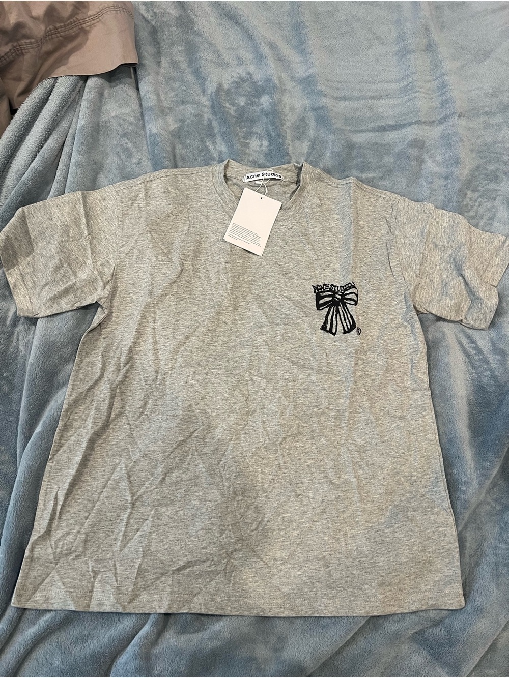 Acne Studios grey t-shirt with bow detail
Size: S
Brand new with tags